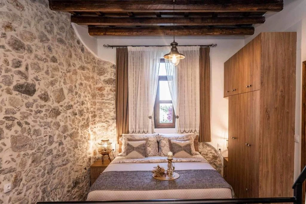 Traditional white-washed Greek villa vacation rental surrounded by olive trees