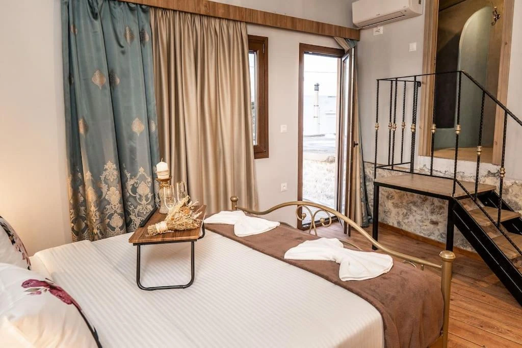 Traditional white-washed Greek villa vacation rental surrounded by olive trees