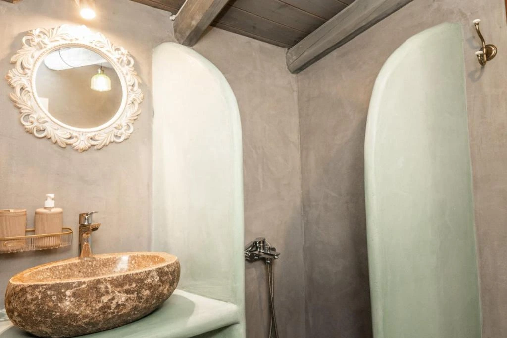 Traditional white-washed Greek villa vacation rental surrounded by olive trees