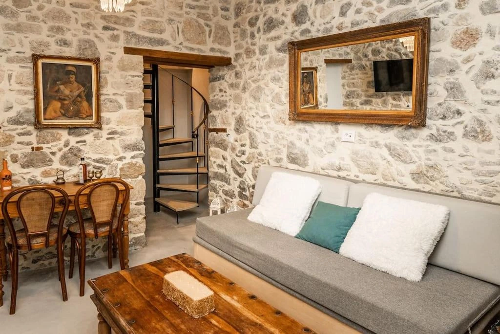 Traditional white-washed Greek villa vacation rental surrounded by olive trees