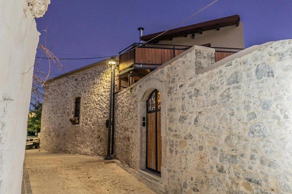 Traditional white-washed Greek villa vacation rental surrounded by olive trees